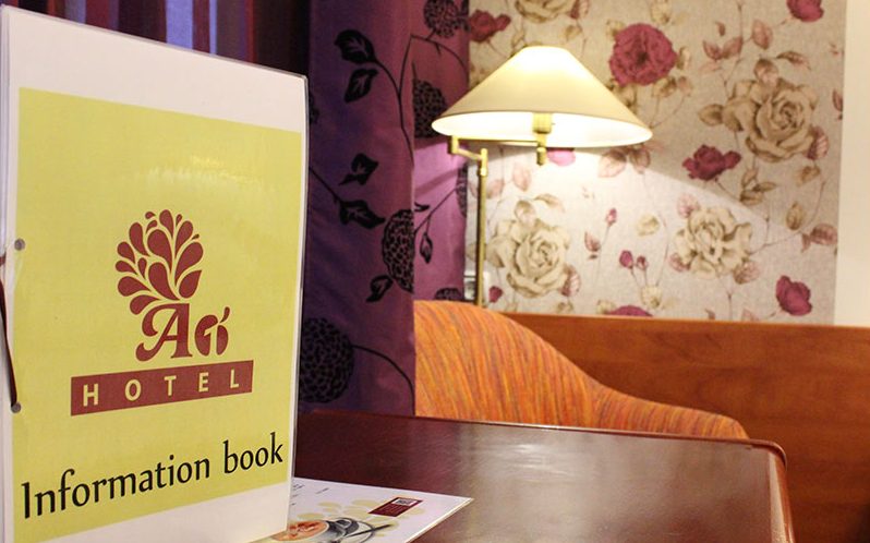 Hotel information book on a desk
