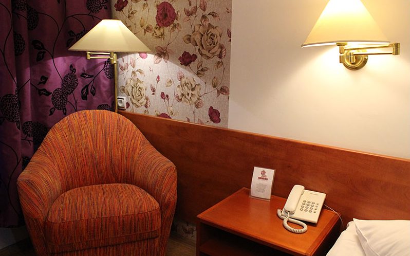 Armchair, reading lamp and telephone