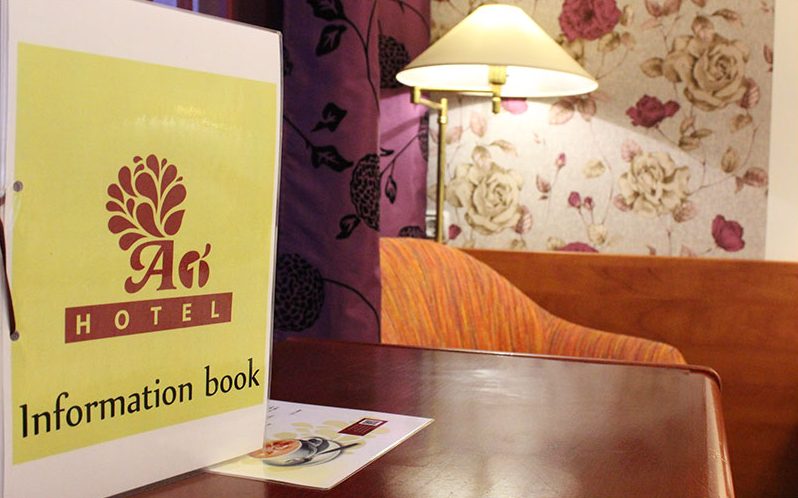 Hotel information book on the desk